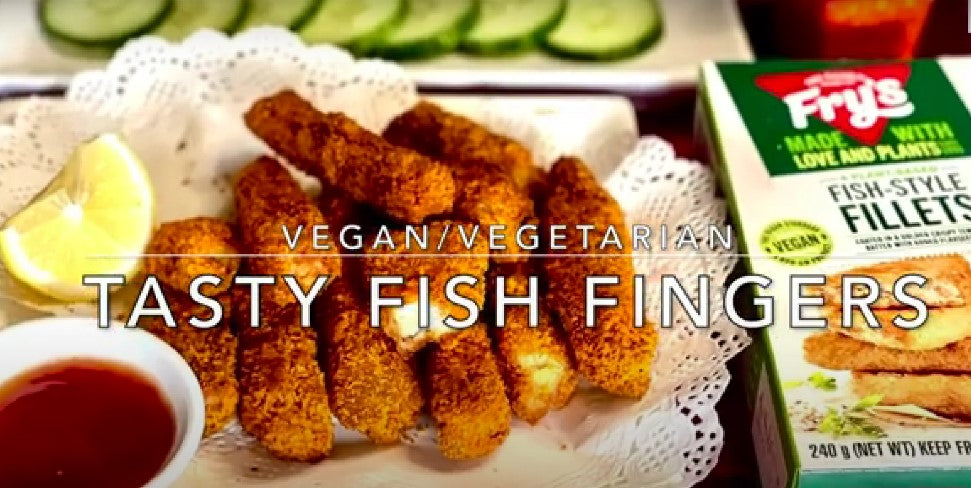 Crispy crumbed vegan fish-style fingers made using Fry's Family Food Fish-Style Fillets, served with chilli sauce and a lemon wedge.